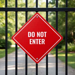 A red diamond aluminum sign displayed on a gate with the message DO NOT ENTER