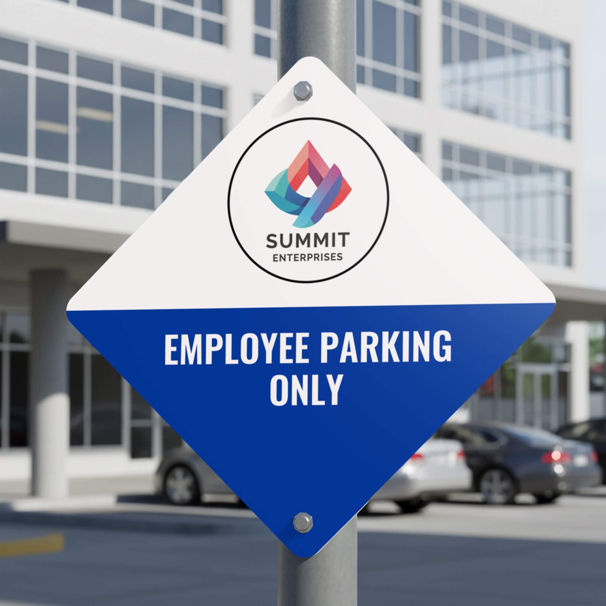 A custom diamond sign with a white and blue split design for employee parking 