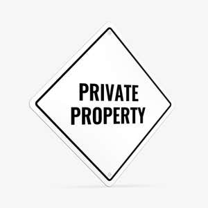 A white diamond aluminum sign with the message PRIVATE PROPERTY