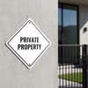 A white diamond sign for a private property