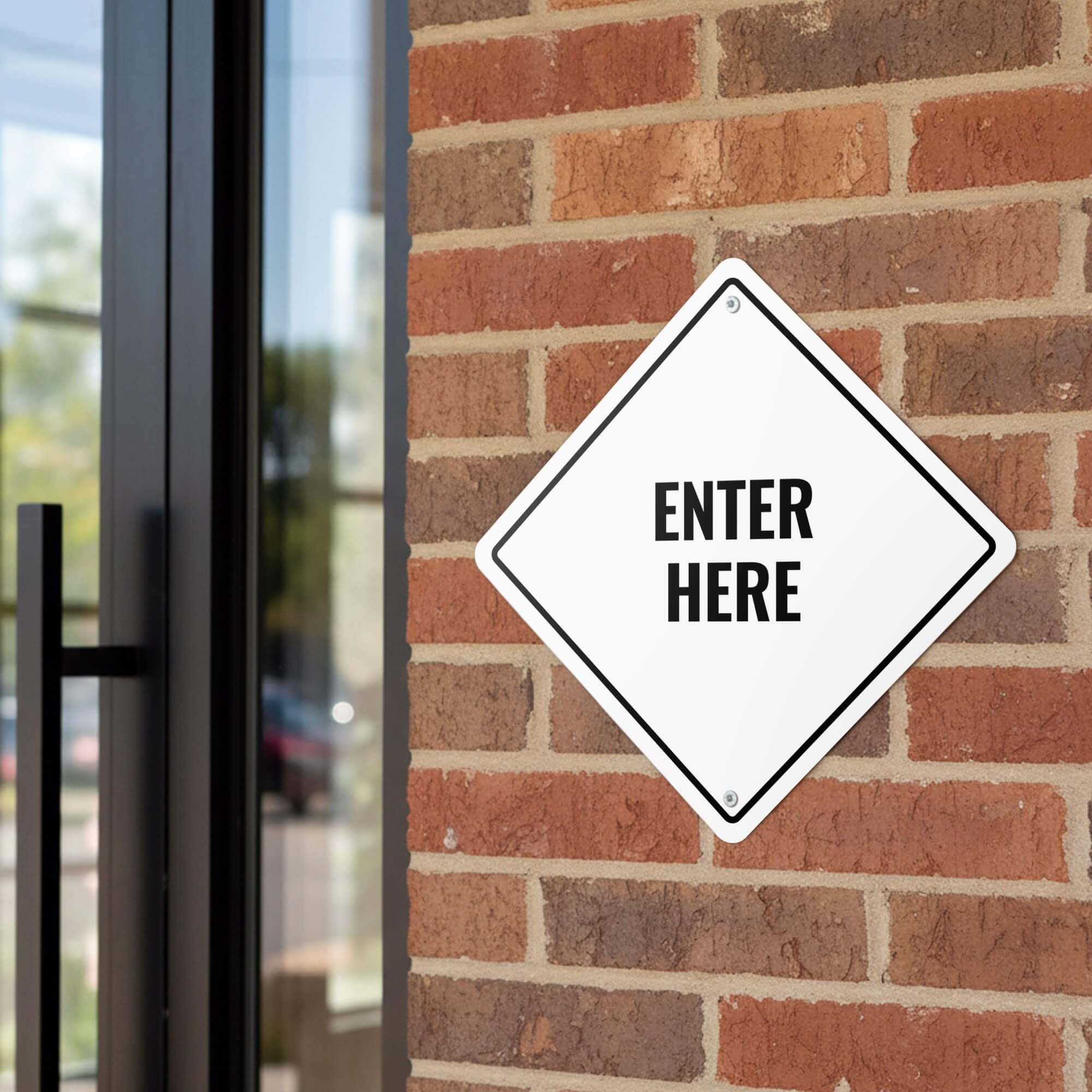 A white diamond aluminum sign for an entrance 