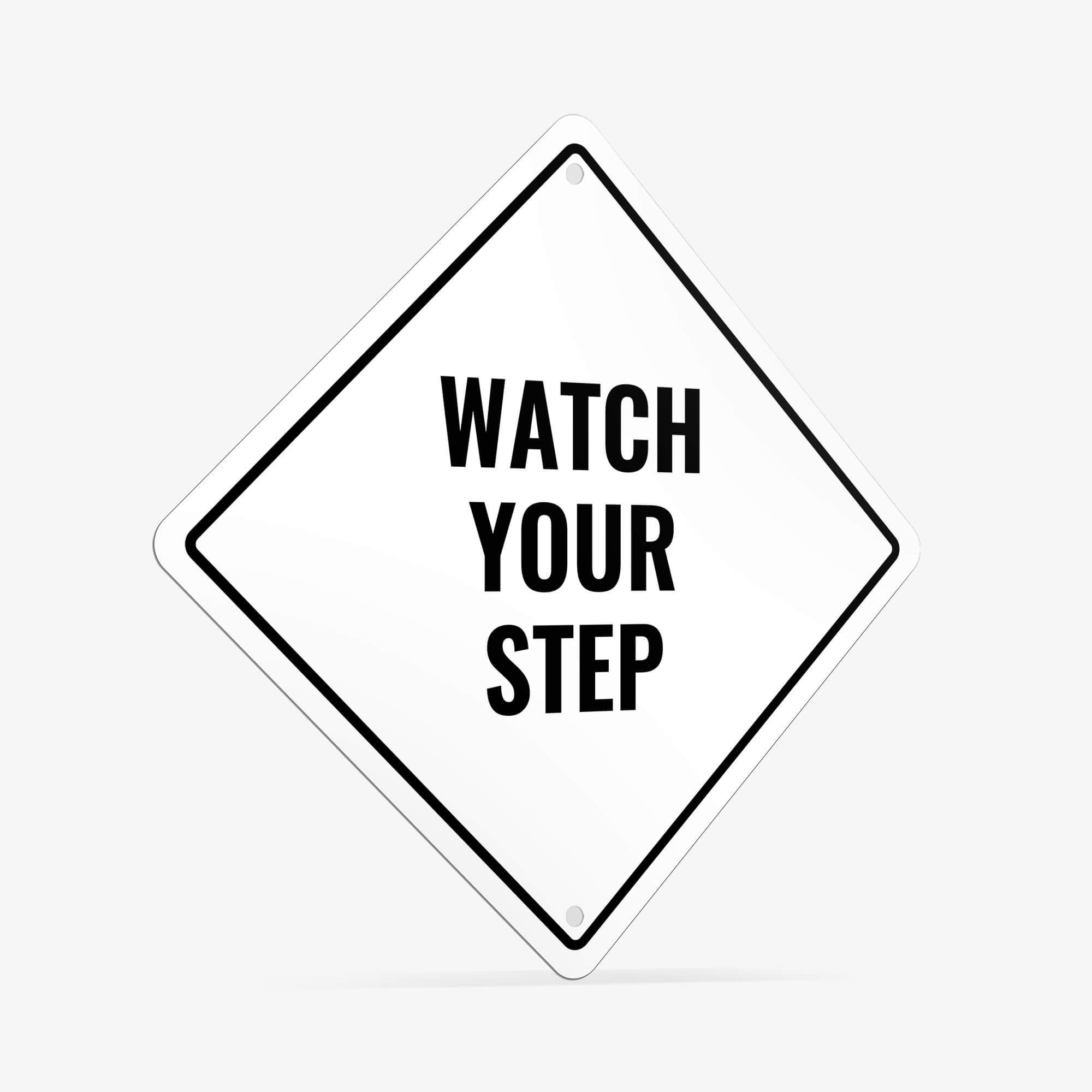 A white diamond aluminum sign with the message WATCH YOUR STEP