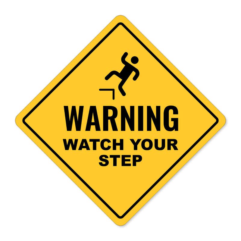 A custom yellow diamond sign with a warning and an icon