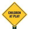 A yellow diamond sign on a post with the message CHILDREN AT PLAY