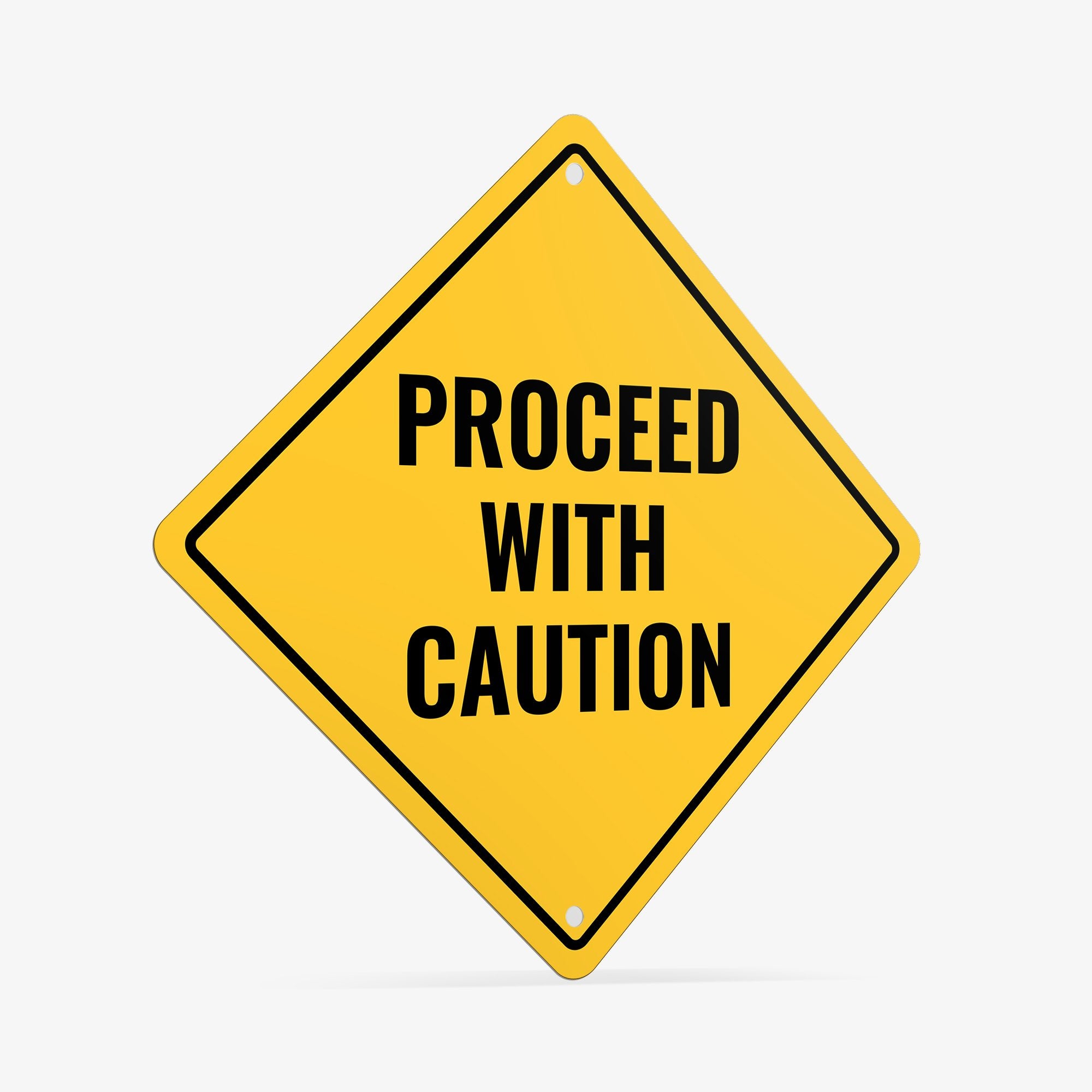 A yellow diamond sign with the message PROCEED WITH CAUTION