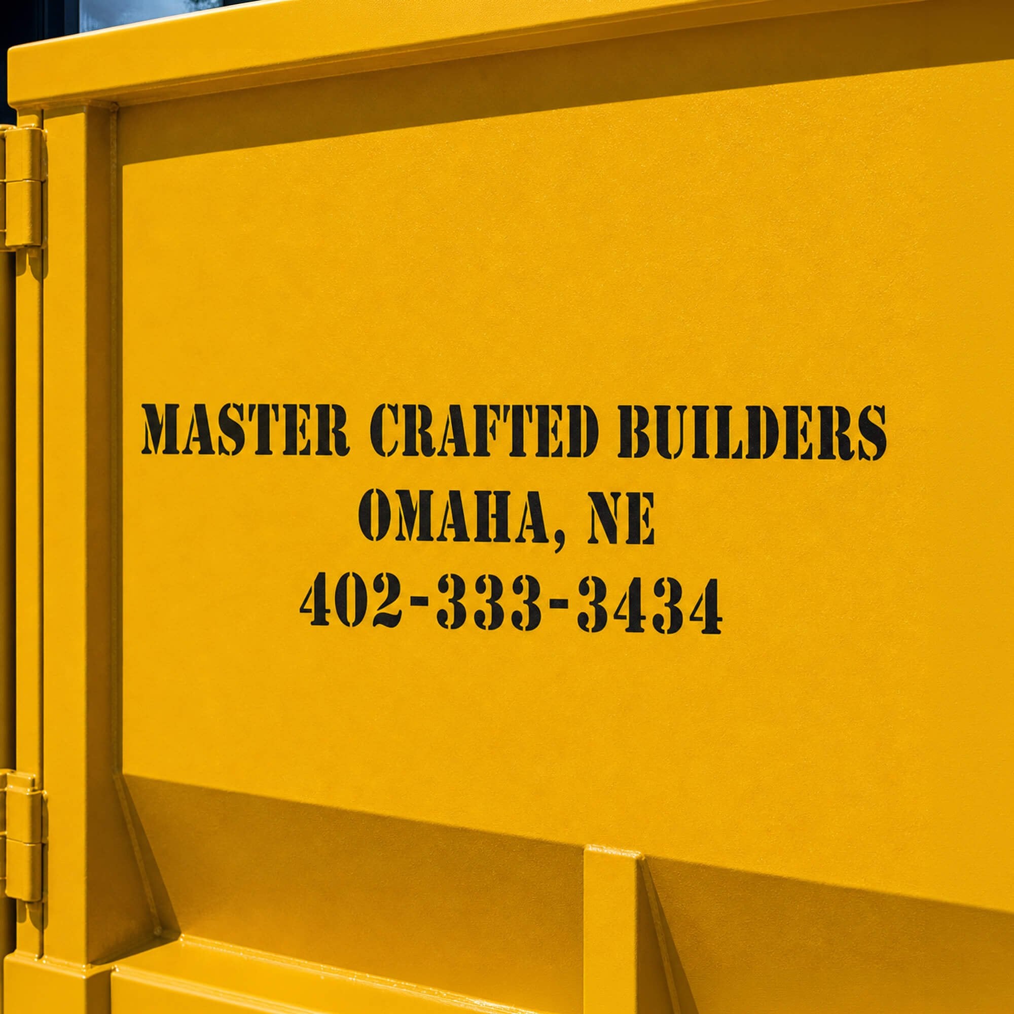 A constructions company's information stenciled onto a container A constructions company's information stenciled onto a container