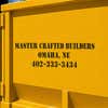 A constructions company's information stenciled onto a container