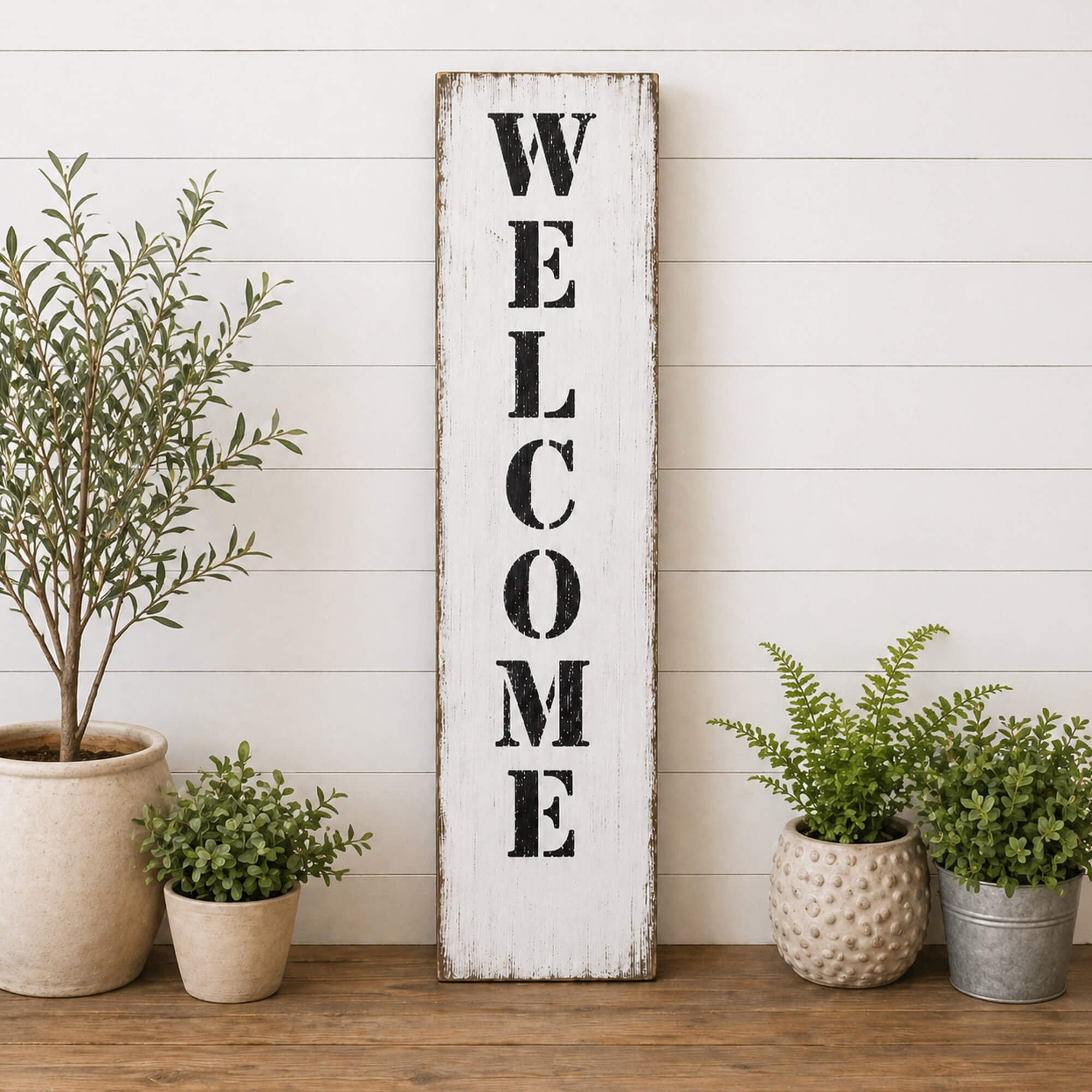 Welcome stenciled onto a white board 