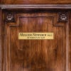 2x10 custom engraved brass sign displayed on a door
