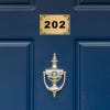 Custom engraved Brass Sign on a Door