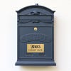 3x6 custom engraved brass sign on a gray mailbox