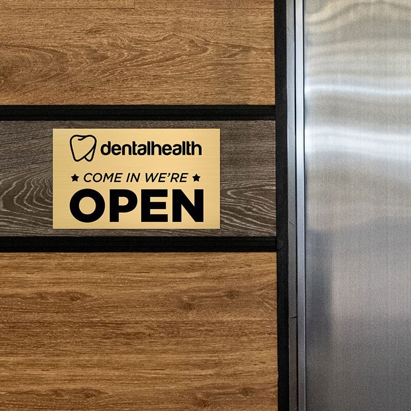 6x10 custom engraved brass sign displayed on a wall