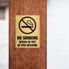 4x3 custom engraved brass sign displayed on a pillar 
