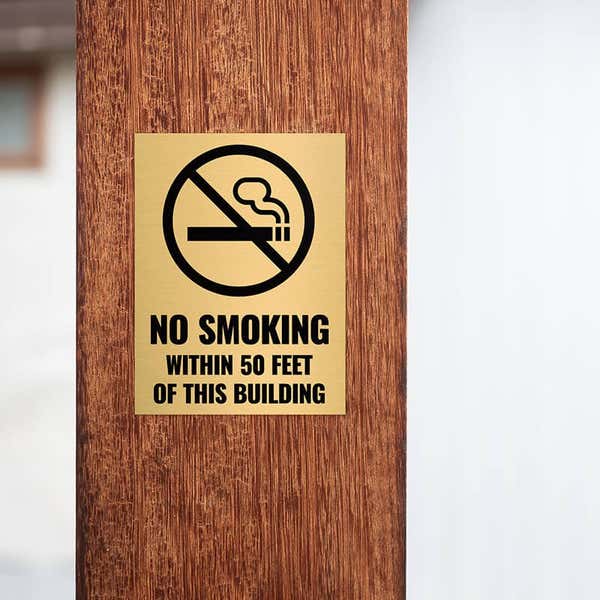 4x3 custom engraved brass sign displayed on a pillar 