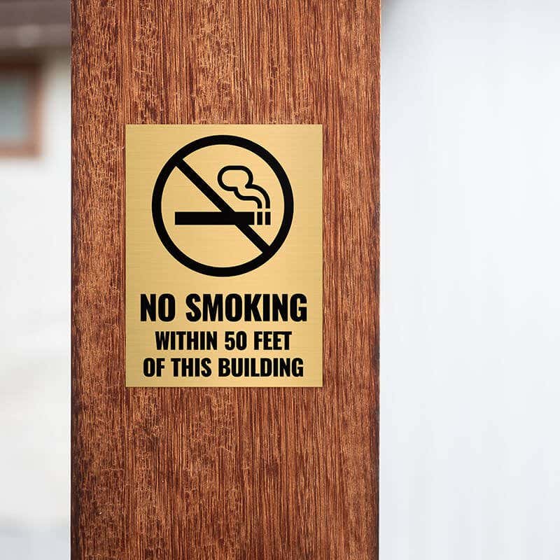4x3 custom engraved brass sign displayed on a pillar 