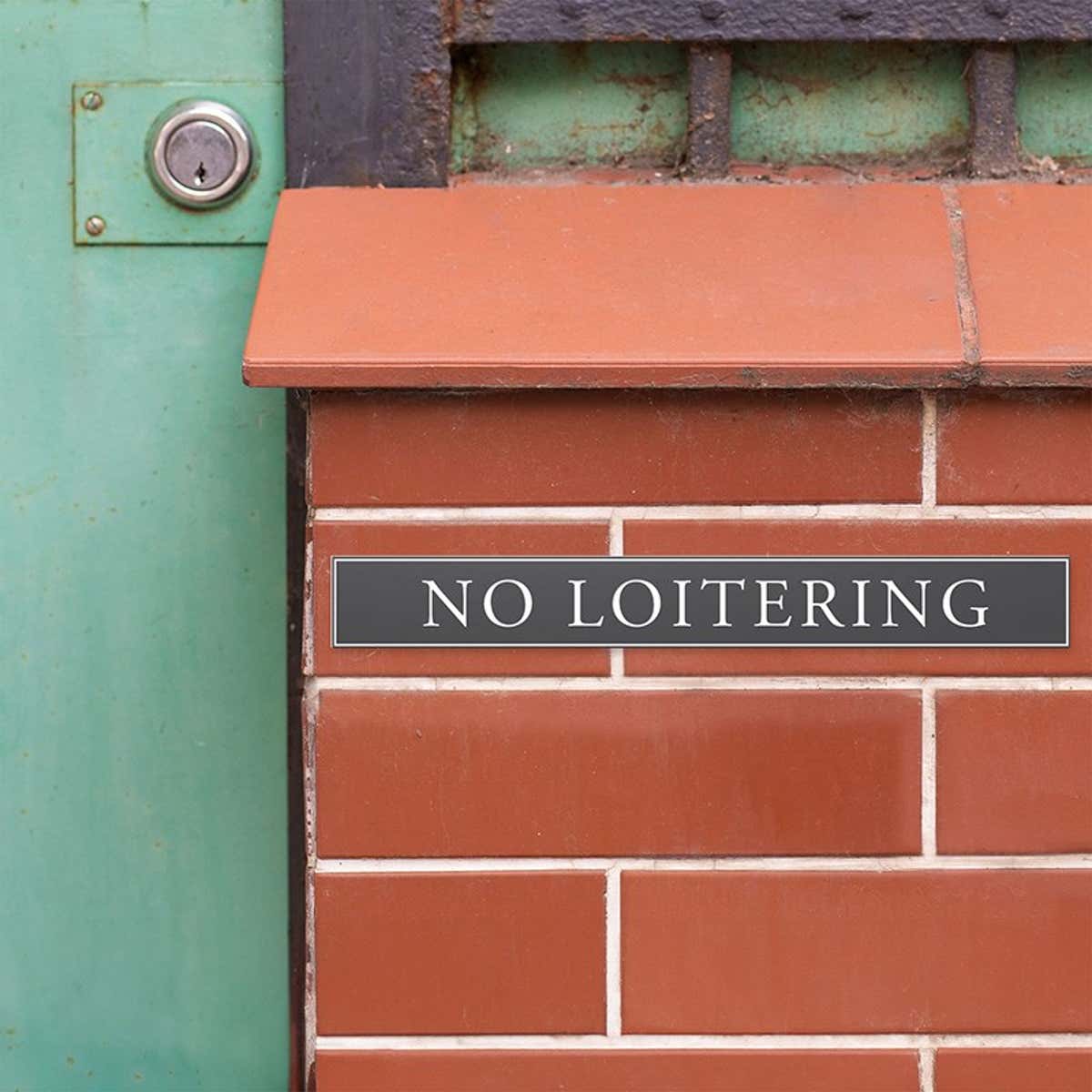Engraved plastic sign for no loitering 