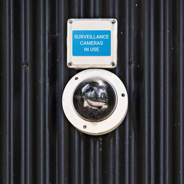 Engraved plastic sign for a surveillance camera label