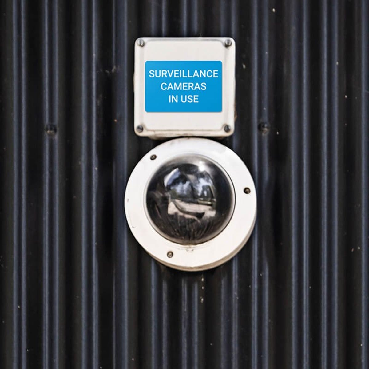 Engraved plastic sign for a surveillance camera label