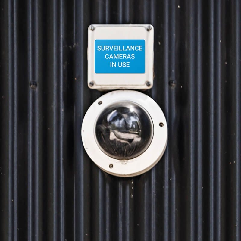 Engraved plastic sign for a surveillance camera label