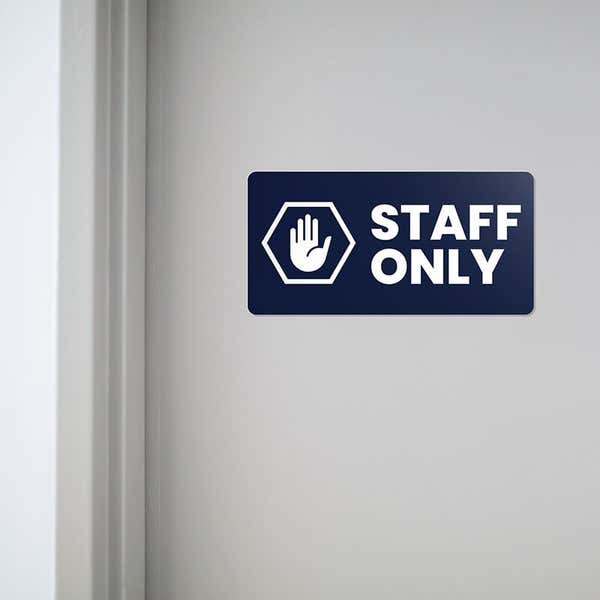 Engraved plastic sign for a staff only entrance