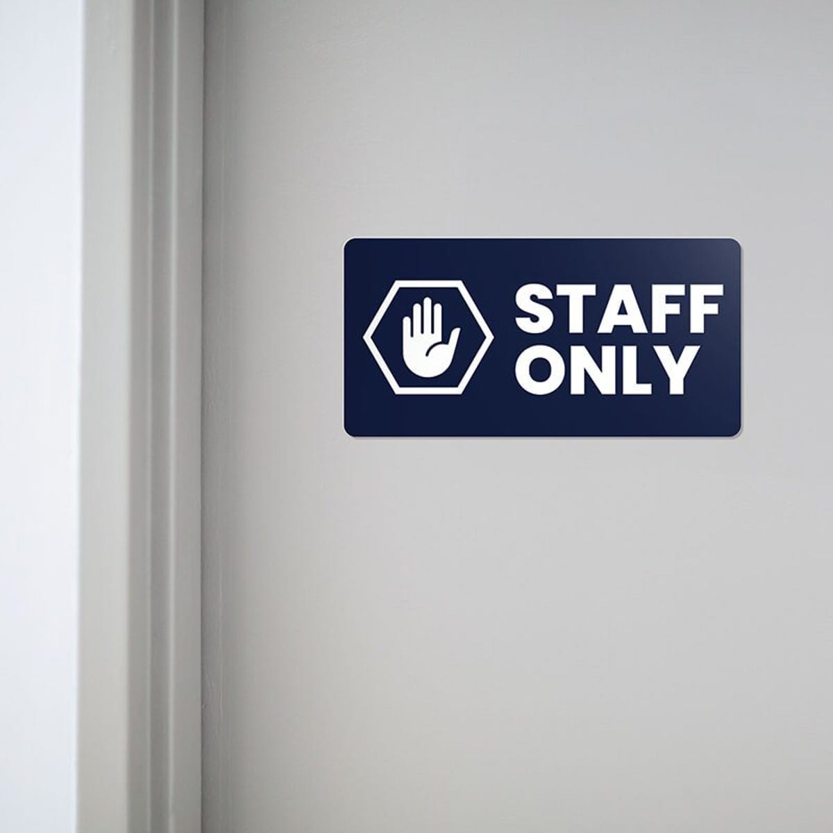 Engraved plastic sign for a staff only entrance