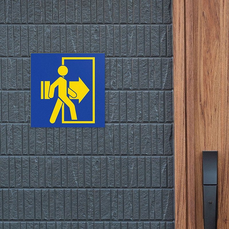 A blue and yellow plastic sign for an exit