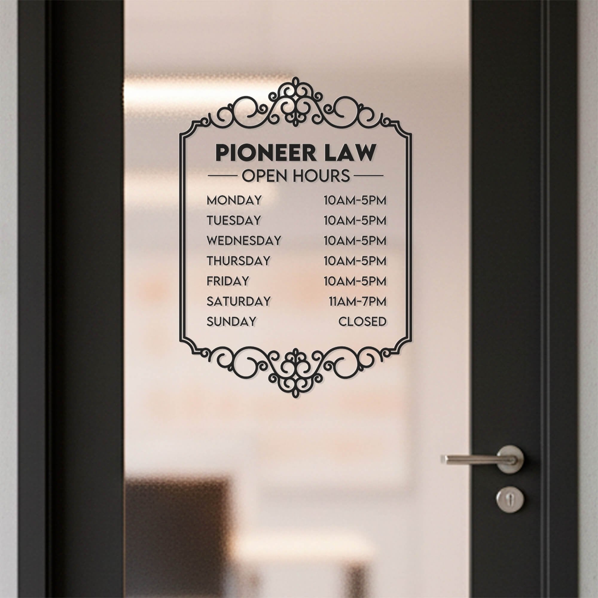 A black business hour decal on a glass door for a lawyers office