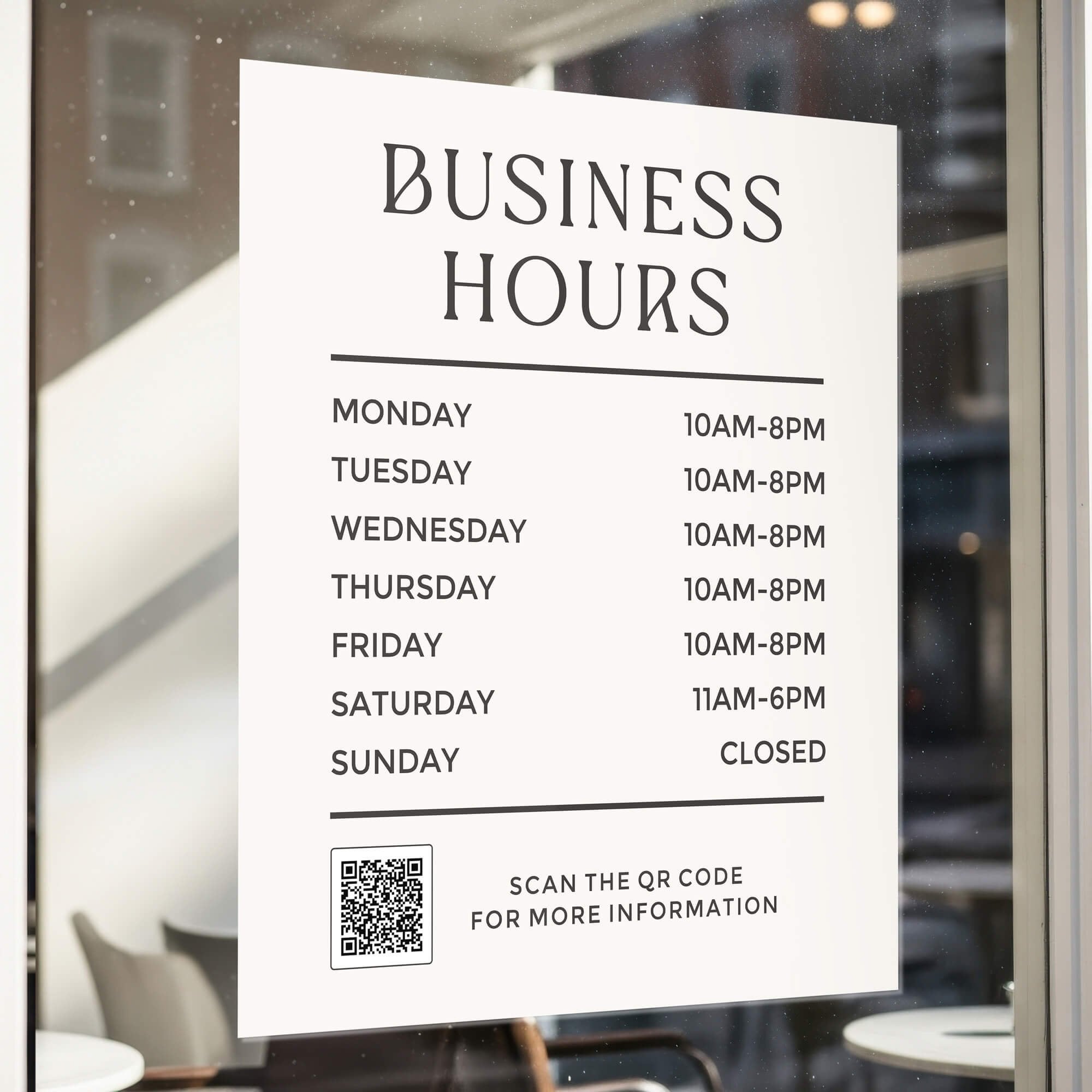 Minimalist business hours sign displayed on the window of an office