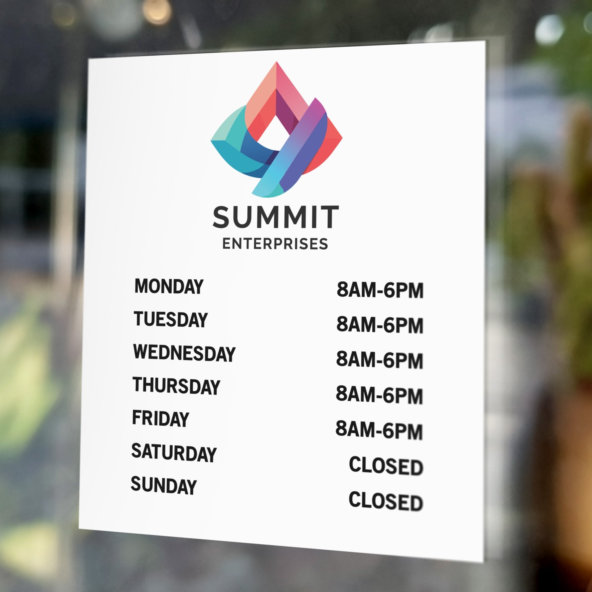 Business hours signs on a window of an office