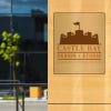 12" x 10" printed brass sign displayed at a front entrance 