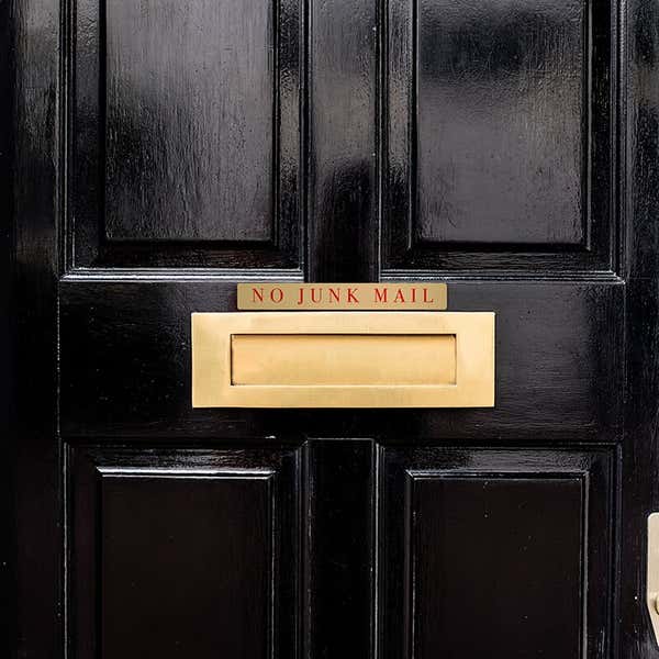 1x8 printed brass sign displayed on a door