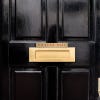 1x8 printed brass sign displayed on a door