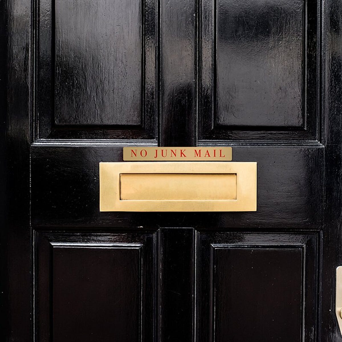 1x8 printed brass sign displayed on a door