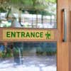 2x12 printed brass sign displayed on a front door