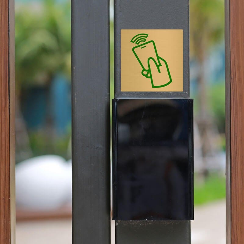 2x2 printed brass sign displayed on a pole