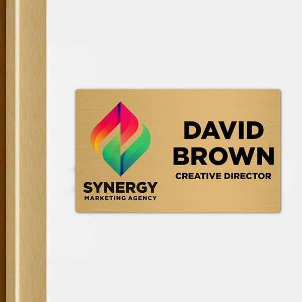 6x10 printed brass sign displayed outside of an office