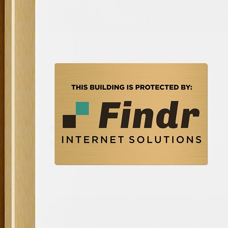 8x12 printed brass sign displayed by a doorway