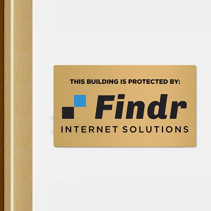 8x14 printed brass sign displayed in a doorway