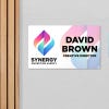 A plastic sign for an office with the employee name and position
