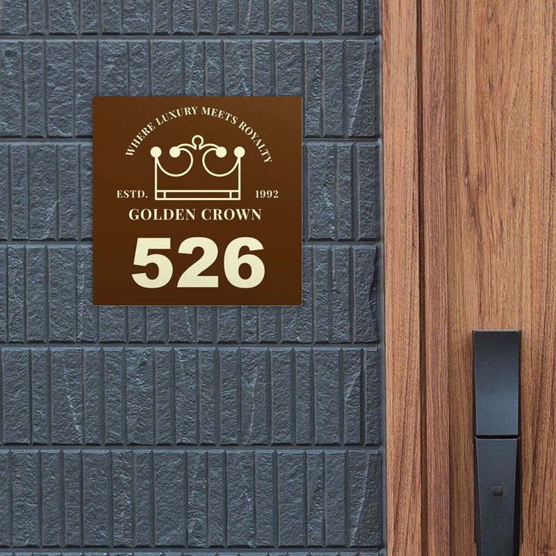 A room number sign with the hotel logo on it