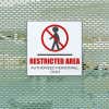 A plastic sign for a restricted area