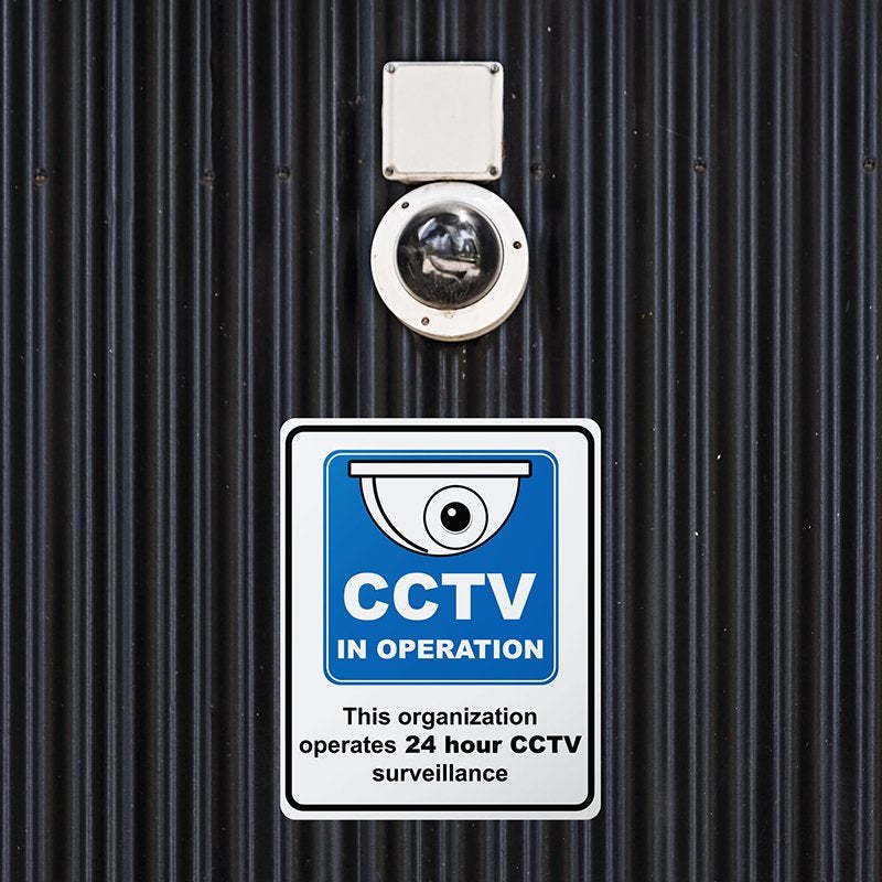 A plastic sign below a CCTV to inform that the CCVT is always recording