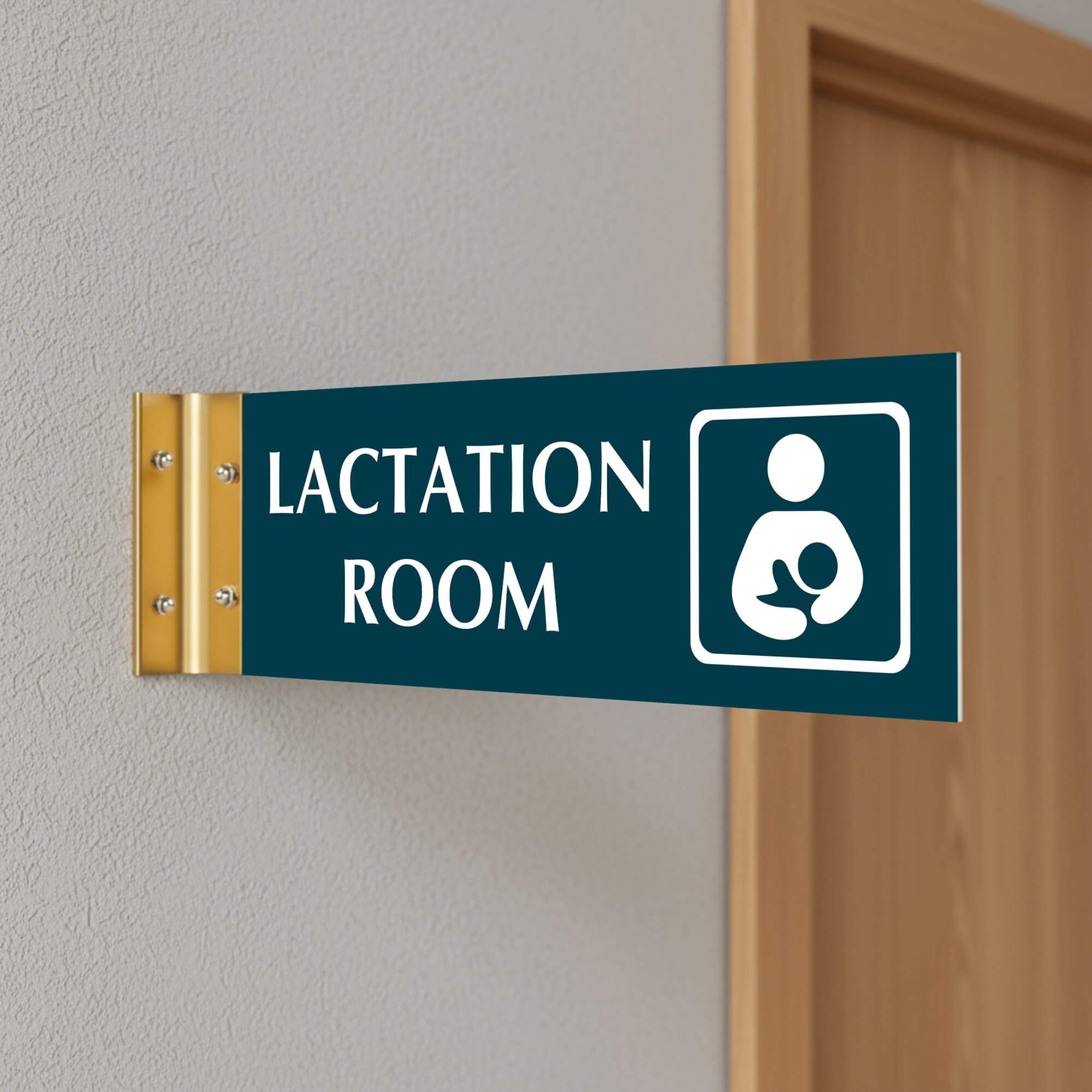 4” x 12” Corridor sign with teal material color, white engraved text, logo and gold holder on a hallway wall with text saying “LACTATION ROOM”.