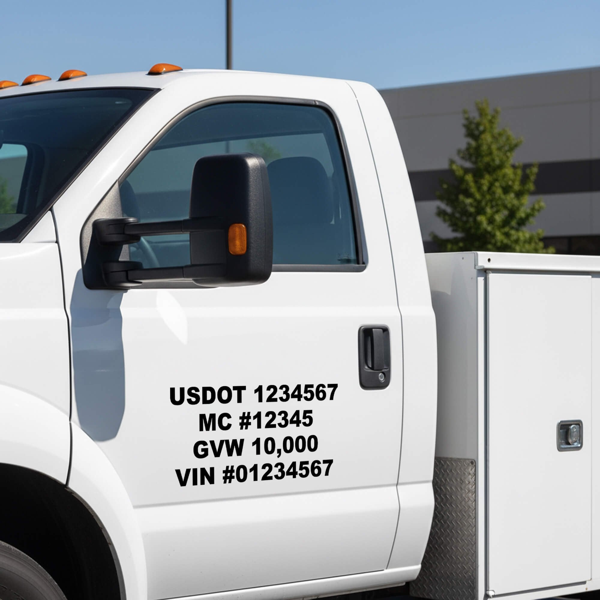 A vinyl decal of a USDOT and other information on a white truck