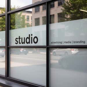 Vinyl lettering on the outside of a building for a studio