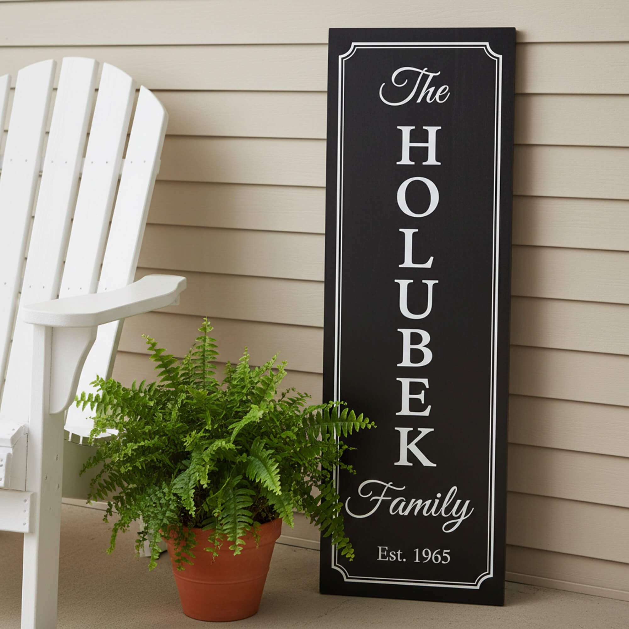 A die-cut decal placed on wood to create a sign