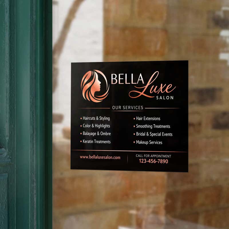An opaque window cling with available services for a hair salon