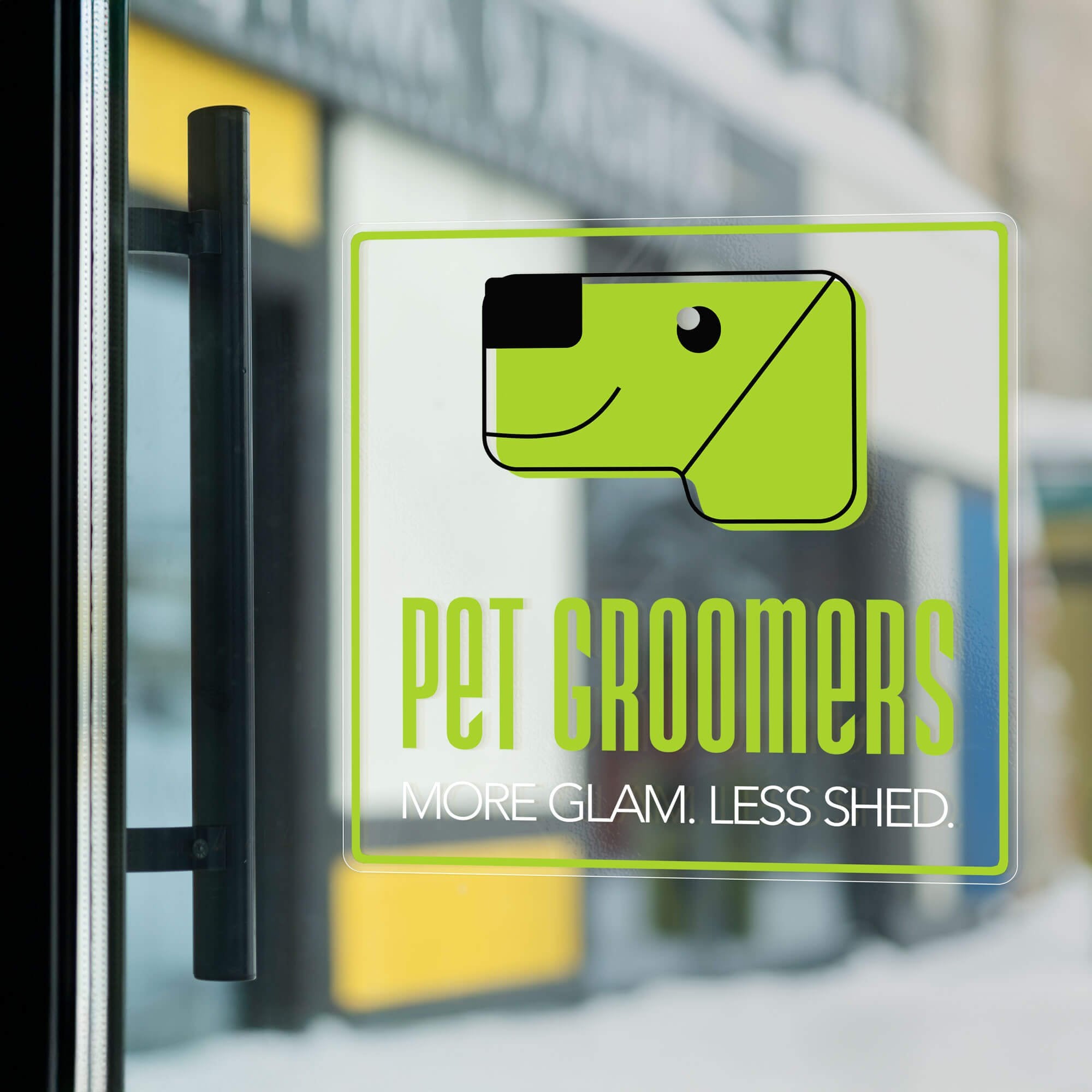 A clear window cling on a glass door for a pet groomers