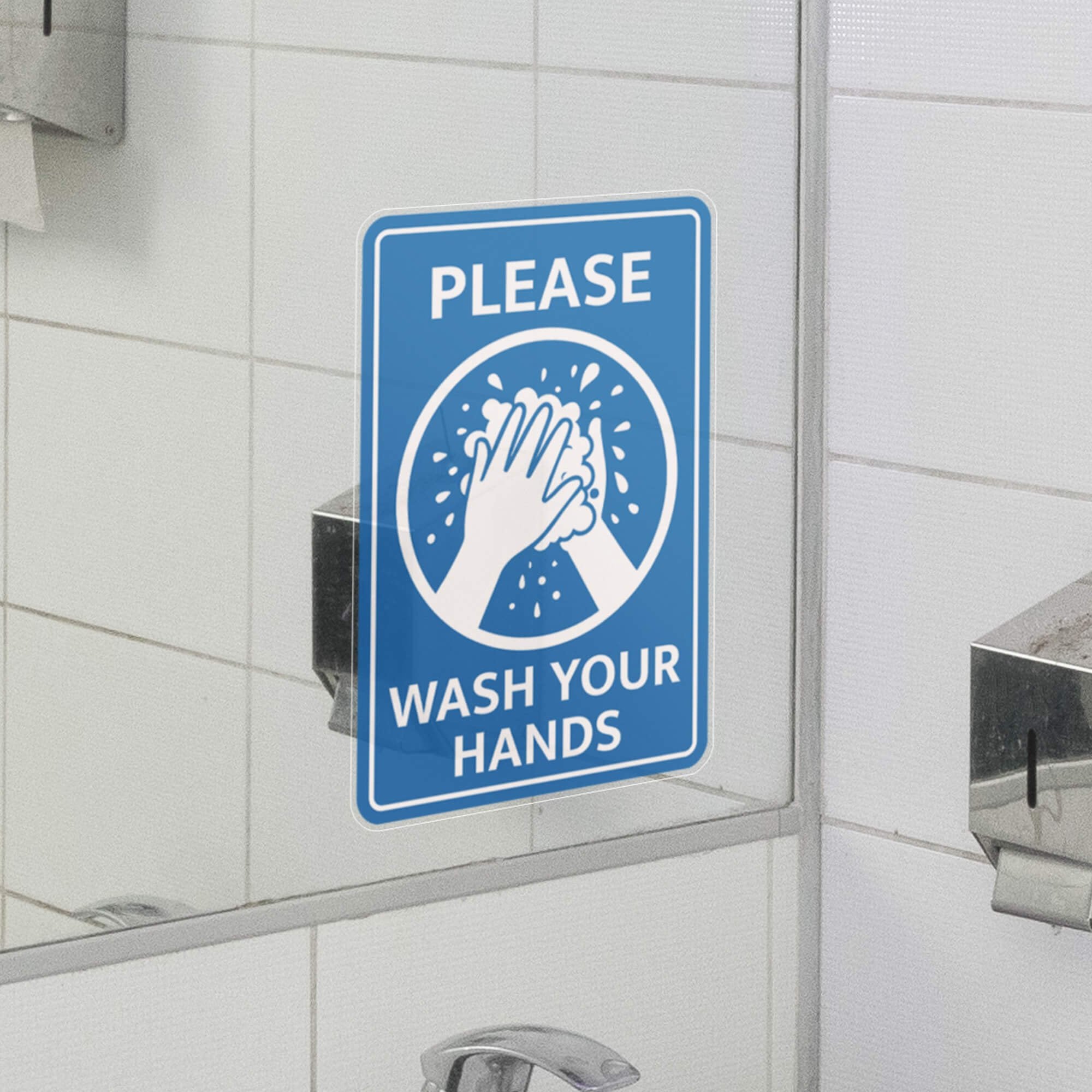 A window cling above a sink to please wash your hands