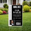 An 18x12 vertical yard sign for a realtor in a yard